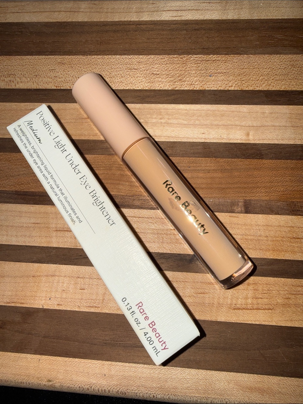Rare Beauty Positive Light Eye Brightener - Light Cream with Pink Logo shade med